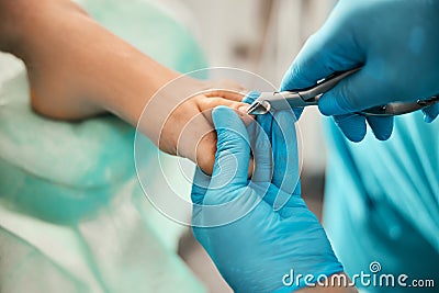 Professional chiropodist using sterile nail clippers instrument Stock Photo