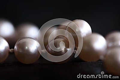 Close up pearls on black paper background. Stock Photo