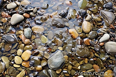 close-up of pebbles smoothed by a rushing stream Stock Photo