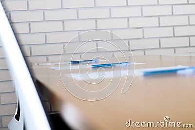 Close up pen on table in empty corporate conference room before business meeting Stock Photo
