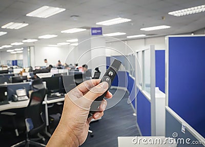 people hand hold wireless presentation pointer in office for meeting and conference Stock Photo