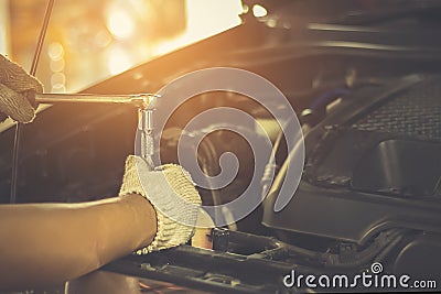 People are repair a car Use a wrench Stock Photo