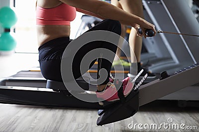 Close Up Of People Using Equipment In Busy Gym Stock Photo