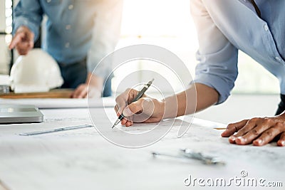 Close-up Of Person`s engineer Hand Drawing Plan On Blue Print wi Stock Photo