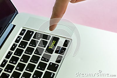 Close up person`s hand finger pushing the `vote` text on a button of laptop keyboard isolated concept v Stock Photo