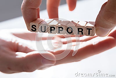 Person Giving Support To Other Person Stock Photo