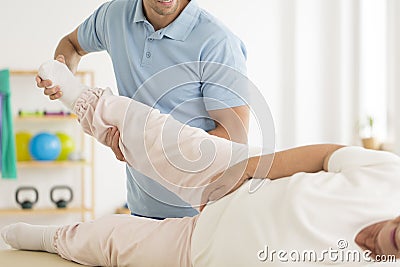 Personal physiotherapist rehabilitating joints Stock Photo