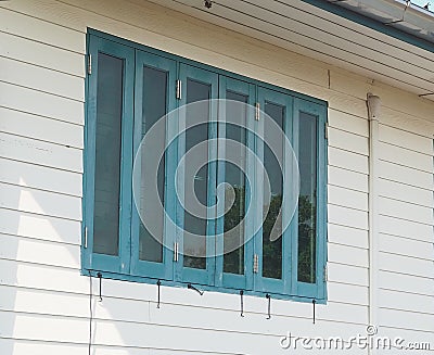 Close-up (perspective), 3 blue casement windows Stock Photo