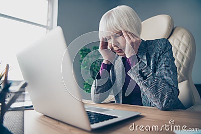 Close up photo of aged business lady unwell hold hand temples overworked need rest day off sit office chair wear costume Stock Photo