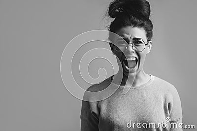 Close-up photo of anger young woman screaming Stock Photo