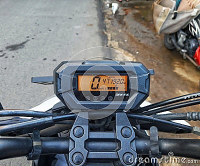 Close up photo of an automatic motorbike speedometer which is quite simple with digital numbers Stock Photo