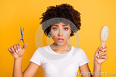 Close up photo beautiful amazing she her dark skin lady hold hair brush scissors hands pros cons minus plus of changing Stock Photo