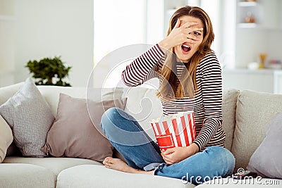 Close up photo beautiful she her model lady hand arm hide face awful ugh scene scary movie big container corns wear Stock Photo