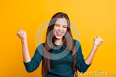 Close up photo beautiful yelling her she lady eyes closed open toothy mouth arms fists raised up air brown eyes ecstatic Stock Photo