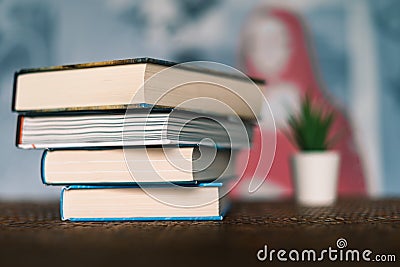 A close up photo of a books tower. Education or self investment time. Background high quality photo Stock Photo