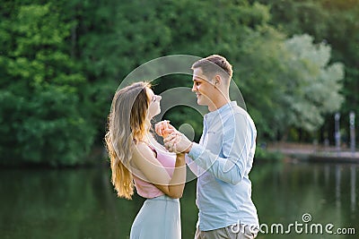 Close-up Photo cheerful happy carefree happy with radiant smile brunette with attractive woman with long hair, they hold hands and Stock Photo