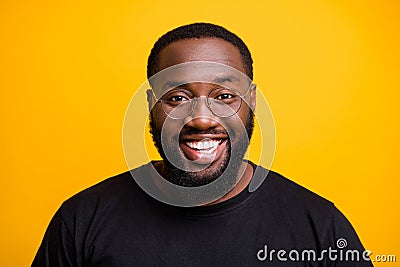 Close up photo of cheerful positive attractive black man with whitened teeth looking at you with smile on face isolated Stock Photo