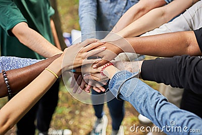 Close-up photo of diverse people`s hands gathered together Stock Photo