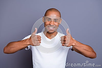Close up photo glad healthy teeth dark skin he him his macho bald head sure approve show thumbs fingers up advise buy Stock Photo