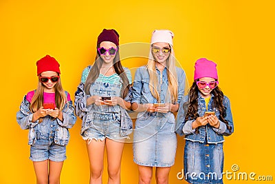 Close-up photo of group of four people influencers using posting following subscribing new sites searching news reading Stock Photo