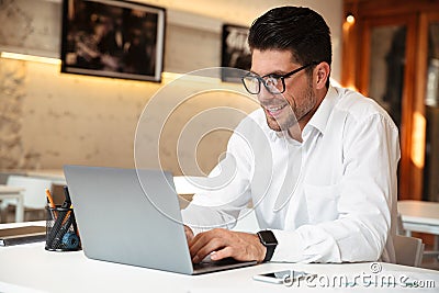 Close-up photo of handsome smiling businessman in white shirt us Stock Photo