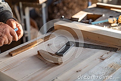 Close up photo, manual processing of wood in the carpentry home workshop, the master work with a peacefullness Stock Photo