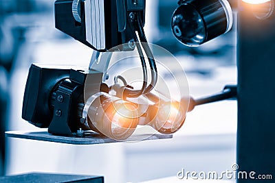 Close up photo of metallic eye piece lens, White optical microscope keep sterile in operating laboratory room. Medical science bio Stock Photo