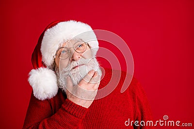 Close up photo minded brainstorm creative old retired man pensioner in santa headwear look copyspace touch chin hand Stock Photo