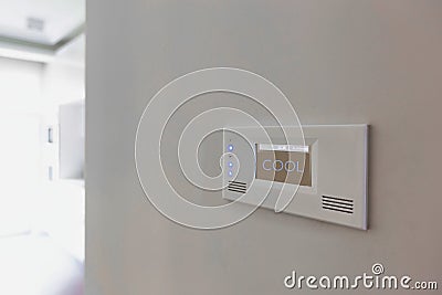Close up photo of modern temperature touch switch board on wall Stock Photo