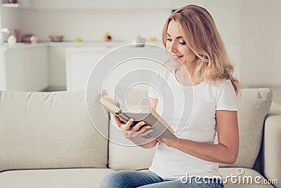 Close up photo of mum did all duties has minute for reading holding hands arms book notebook diary resting wear white t Stock Photo