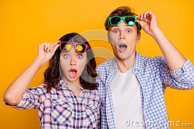 Close up photo of pair in raised up summer glasses specs he him his she her lady boy showing shock staring with open Stock Photo