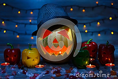 Close up photo of scaring frightening terrifying orange lightening with candle pumpkin in dark night Stock Photo