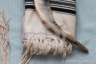 A close-up photo of a shofar and tallit, Stock Photo