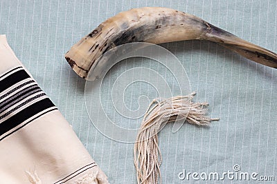 A close-up photo of a shofar and tallit, Stock Photo