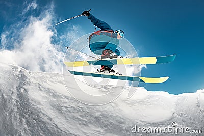 Close-up photo of skier jumping over camera Stock Photo