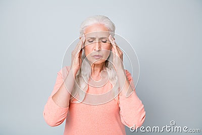 Close up photo of upset exhausted old lady suffering from strong headache reaction on magnetic storm and weather Stock Photo