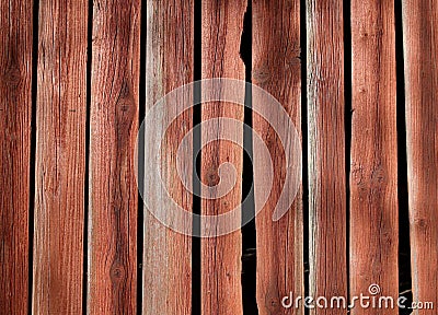 Old, rustic wooden wall painted with red ochre Stock Photo