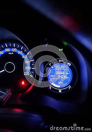 Car dashboard, speedometer panel in night time. Stock Photo