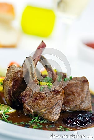 Close up picture of a roasted lamb chop and vegeta Stock Photo