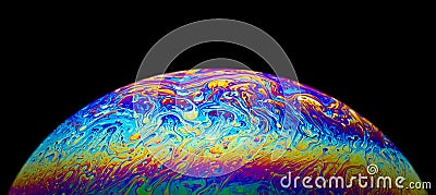 Close up picture of soap bubble psychedelic color half circle shape on black background Stock Photo