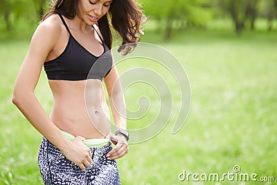 Close up picture of woman trained abs outdoors Stock Photo