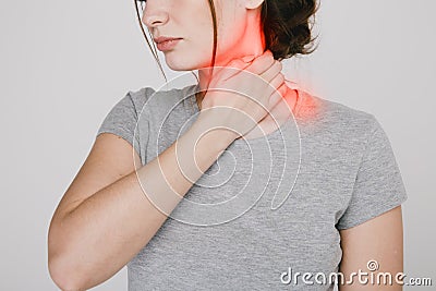 Close up picture of young woman with neckache isolated. Stock Photo