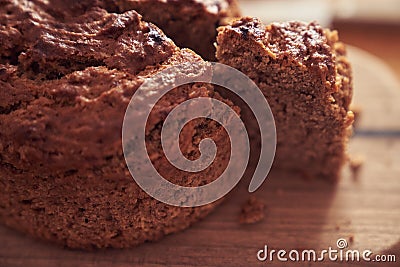 A close-up of a pie where a piece is cut off from the whole part. Diet dessert - Banana cake without milk, gluten-free Stock Photo