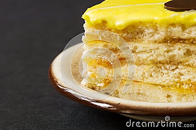 Close-up of a piece of a lemon cake on a plate Stock Photo
