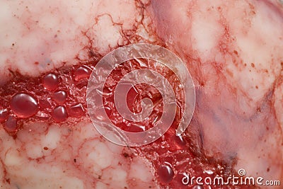 a close up of a piece of meat with blood on it Stock Photo