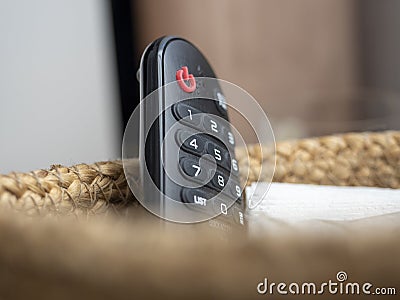 Close-up of a piece of plastic remote control for the TV. Selective Focus Stock Photo