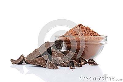 Close-up pieces of chunk black chocolate with glass bowl of cocoa powder Stock Photo