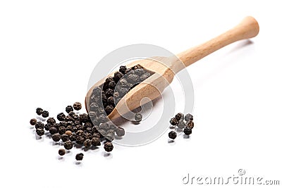 Close-up of pile of Black pepper seeds spice in a wooden spoon o Stock Photo