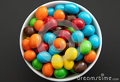 Close up of a pile of colorful chocolate coated candy, chocolate background Stock Photo