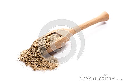 Close-up of pile of ground cardamom spice in a wooden spoon on w Stock Photo